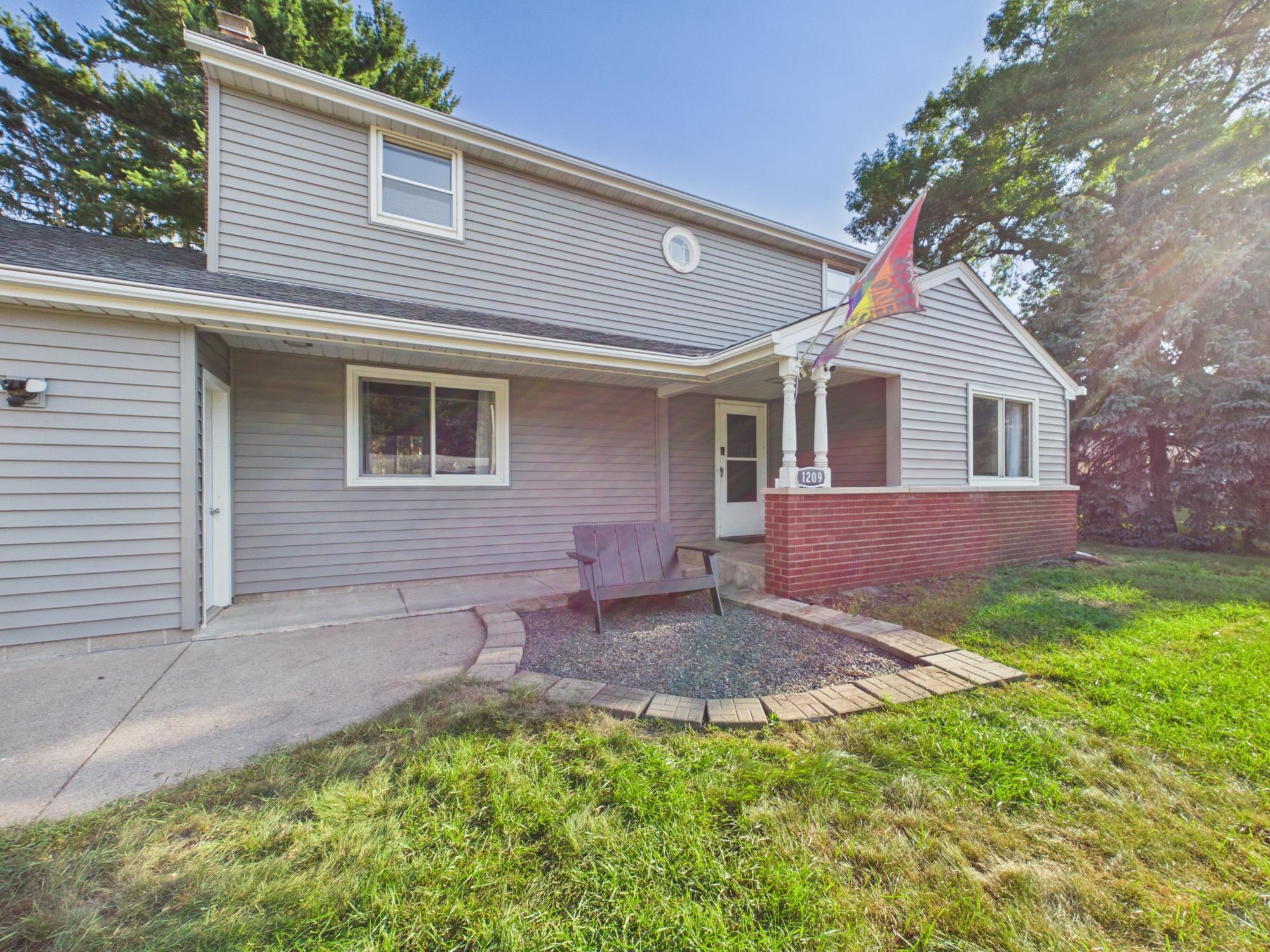 Main entrance and patio area provides a convenient spot for outdoor seating just steps from the house.