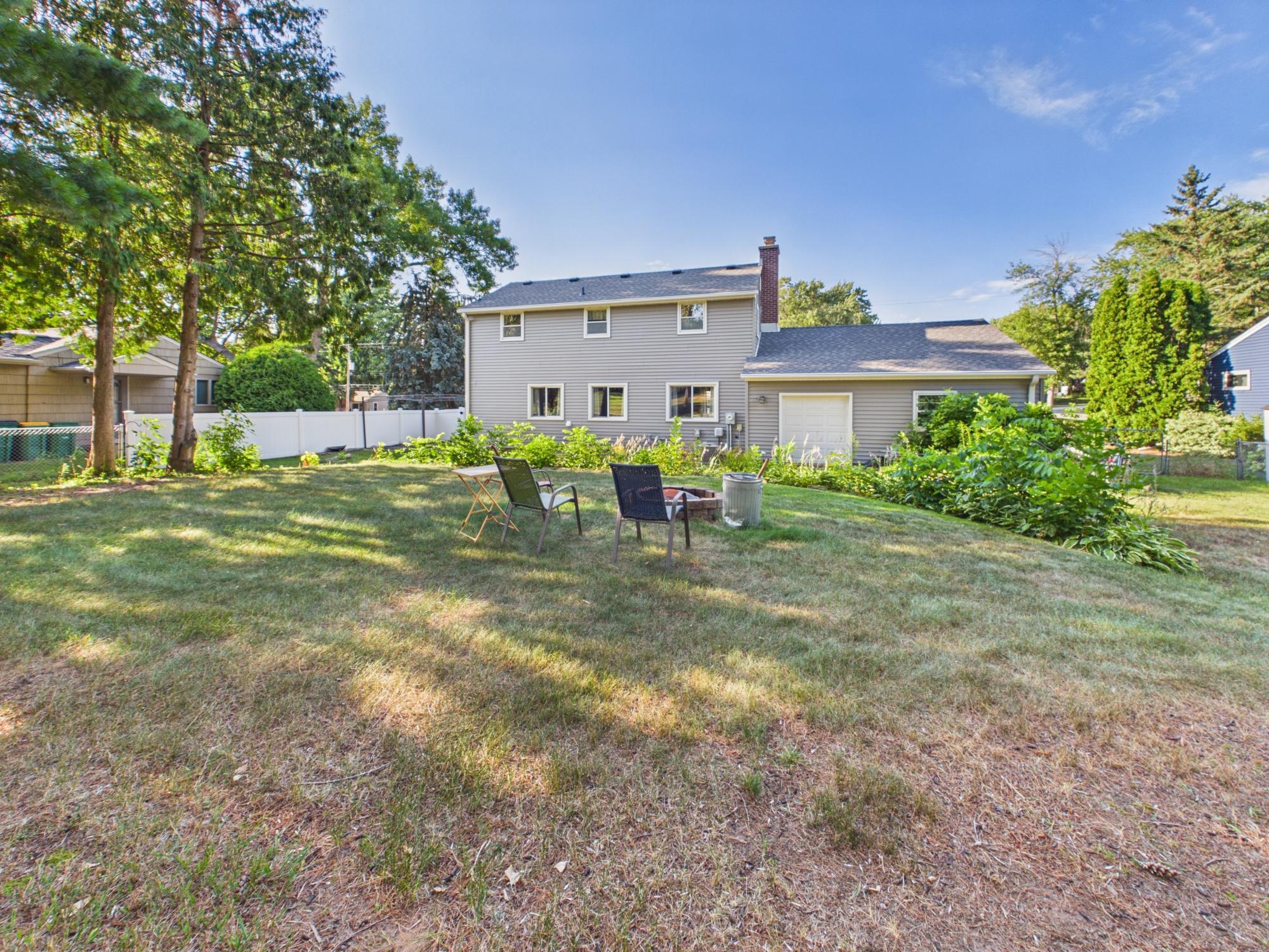 View across the backyard toward the home, giving a great perspective on the depth and usable space of the lot.