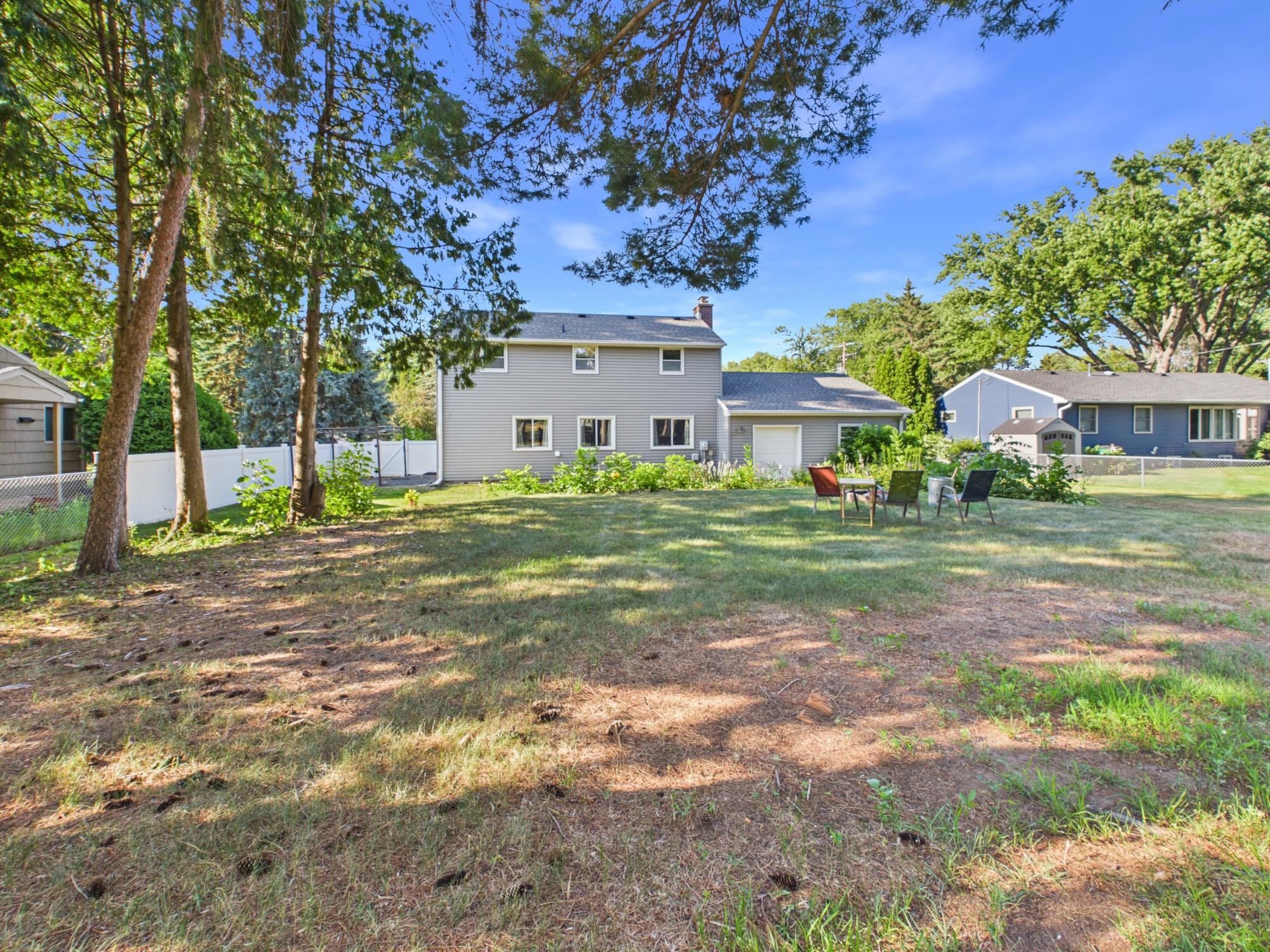 Wide backyard view showing the impressive amount of space between the home and the rear of the property.