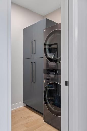 Main floor laundry room with storage space