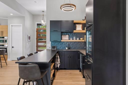 Floating shelves add room to display favorite barware or additional storage