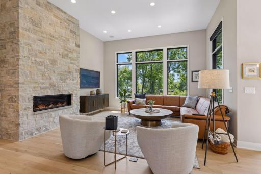 Step into the great room with floor to ceiling stone surround fireplace