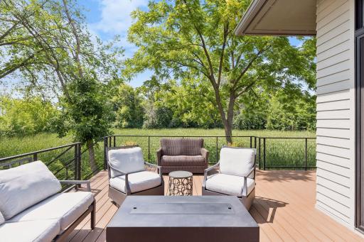 Wrap-around deck allows for plenty of seating and stairs that lead to the backyard
