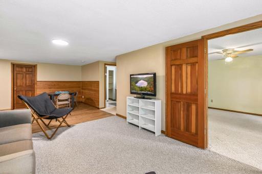 Family room has activity area with new wood floor