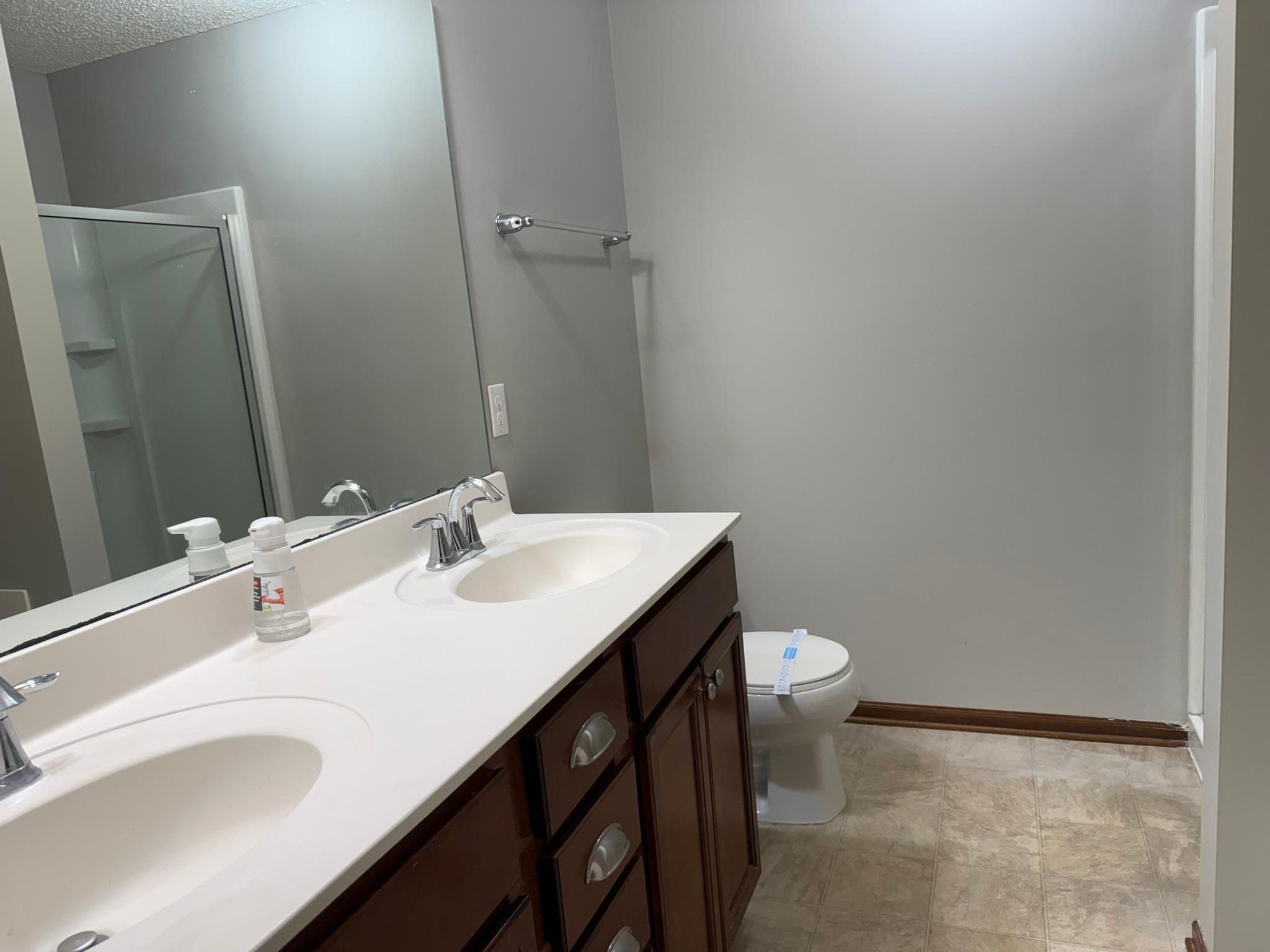 10A-Primary BR private bath with dual sinks and separate tub and shower.JPEG