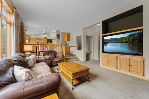 Living room is open to kitchen and breakfast nook.jpg
