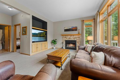 Cozy living room with fireplace and large TV cabinet.jpg