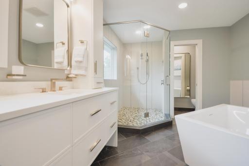 Updates include tile flooring, double vanity, Eqyptian marble countertops