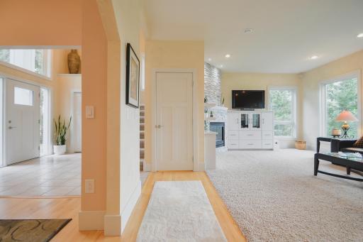 Maple hardwood flooring throughout the kitchen, dining area, and hallway