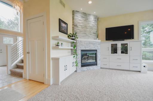 Featuring custom cabinetry, and a stone fireplace surround added in 2024