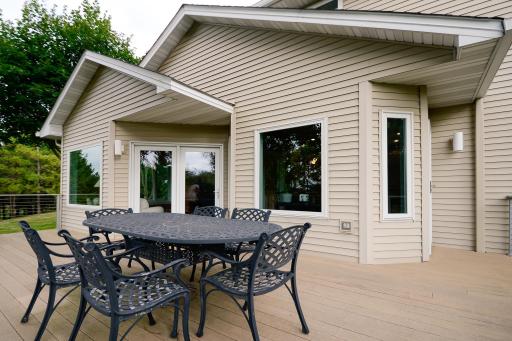Deck overlooks the large and expansive backyard