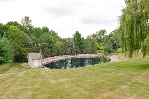 Landscaped recreational pond with warming shed