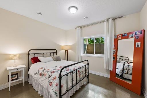 Also located on the lower level is a spacious bedroom with natural light, making it ideal for guests, family members, or a private home office.
