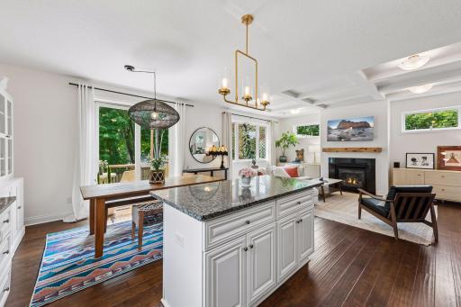 Gather with family and friends in this open-concept space where the oversized granite island overlooks the dining area and cozy living room, creating the perfect setting for entertaining year-round.