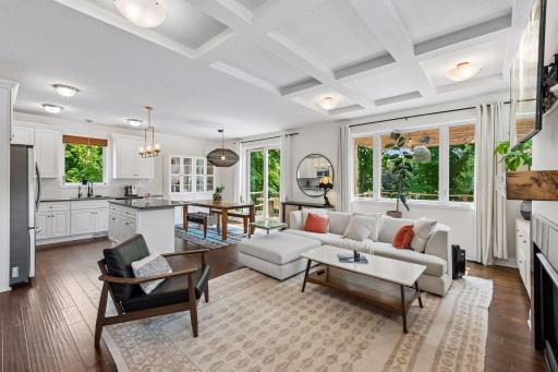 Designed for both comfort and style, this open living area seamlessly connects to the kitchen and dining spaces while showcasing elegant finishes and a beautiful gas fireplace.