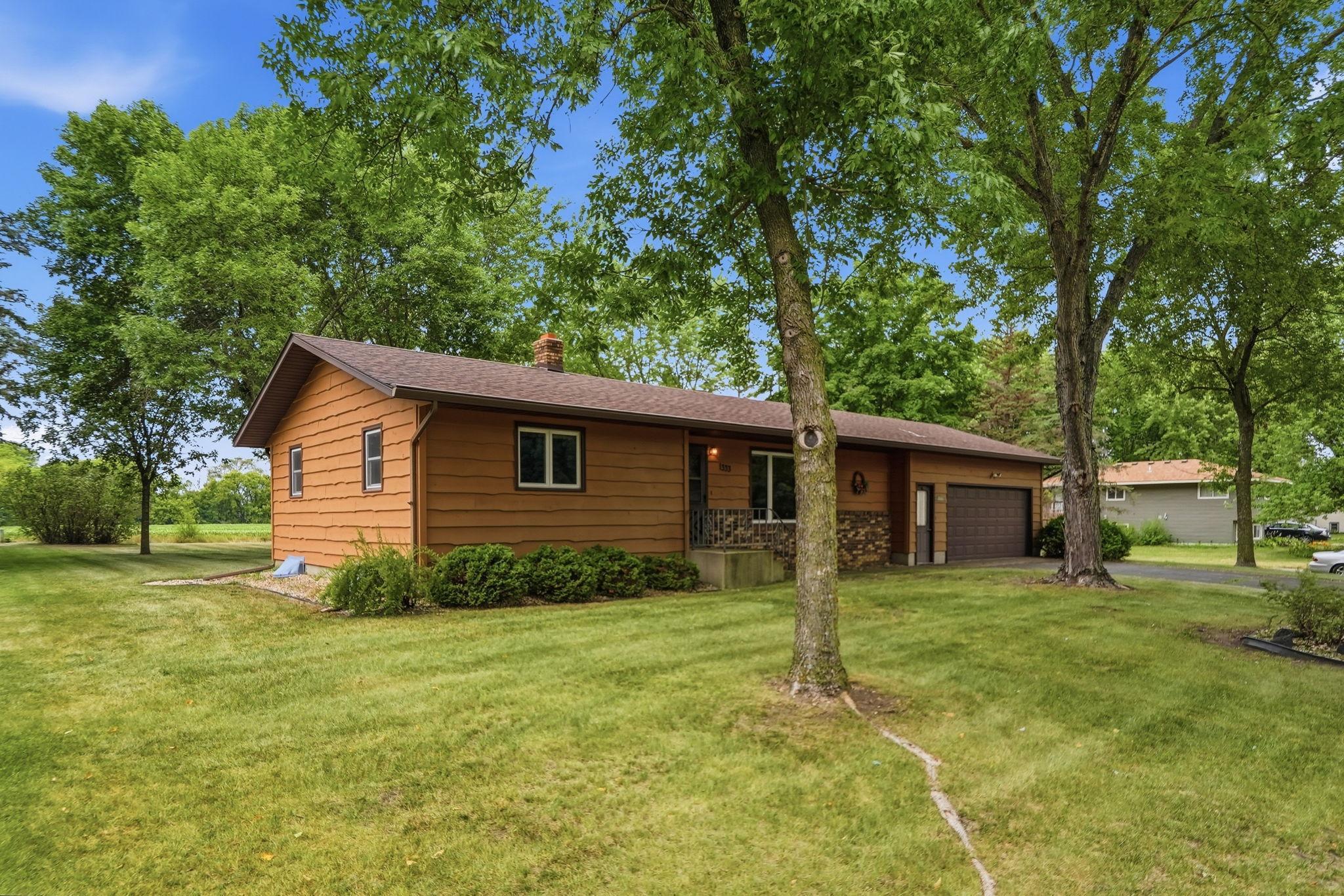 Mature trees fill both the front and back yards!