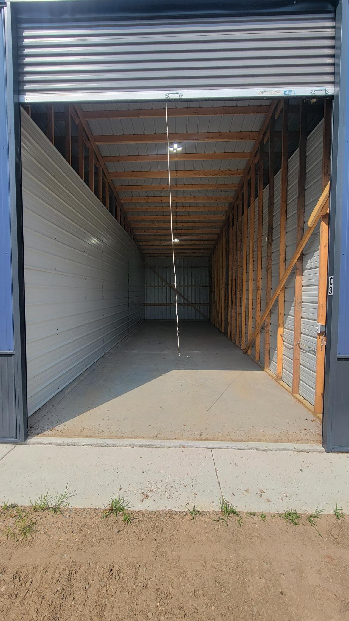 One of eight spacious 12' x 38' rental storage units with 14-foot overhead door and concrete floor