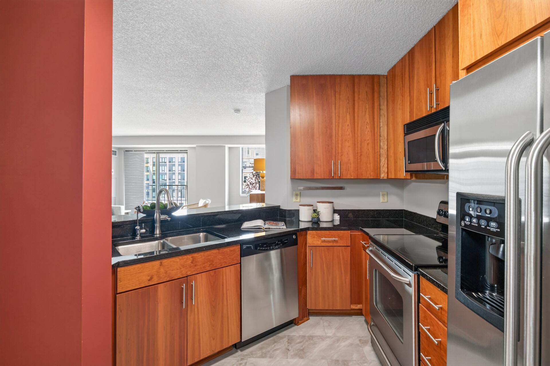 Kitchen Opens up to Living and Dining Spaces