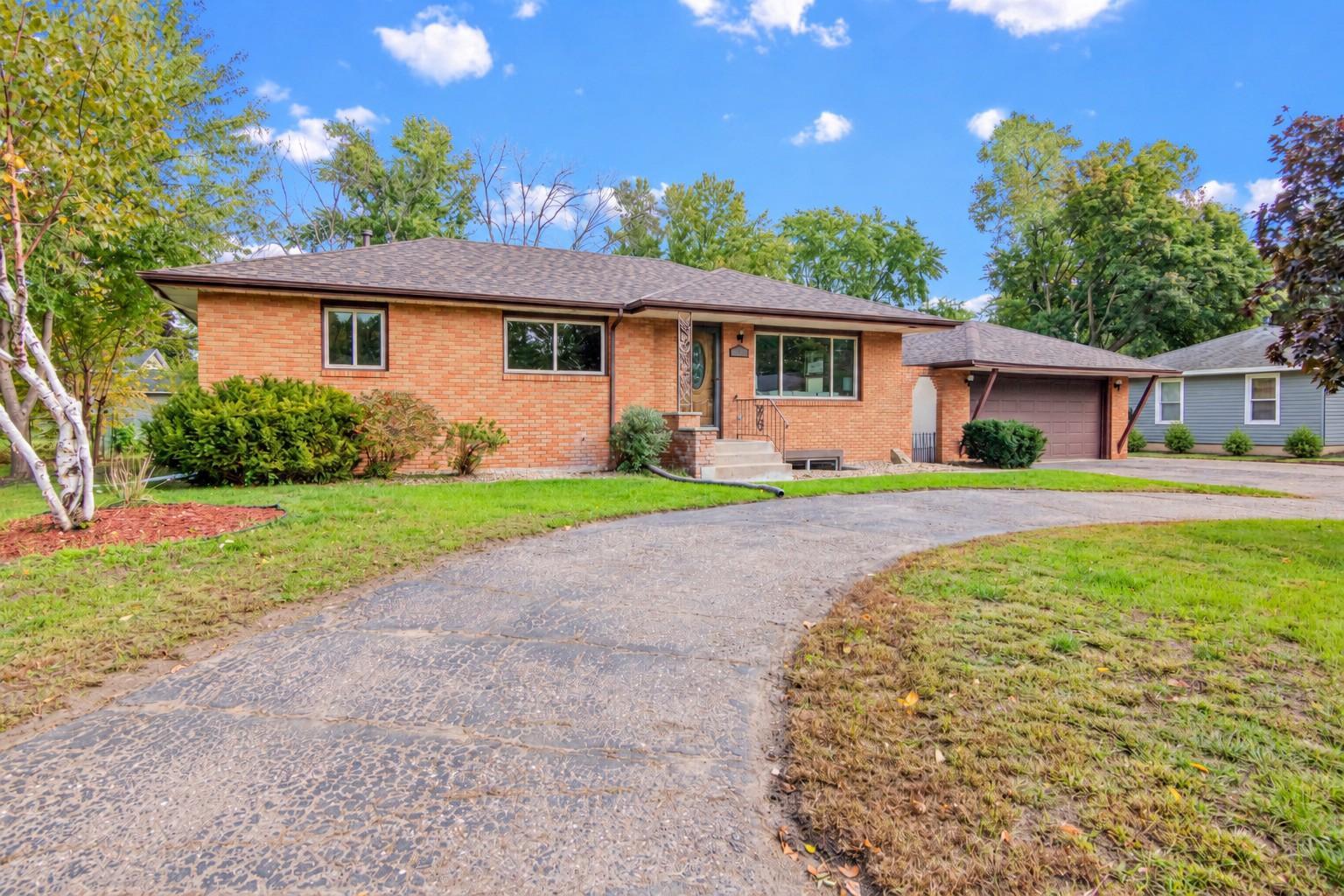 Circular drive and spacious garage add everyday convenience.