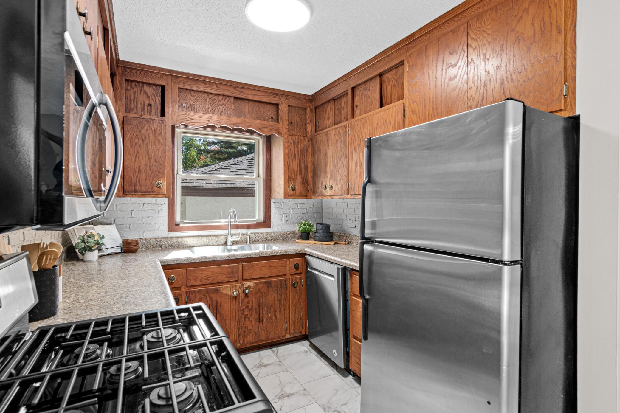 A practical kitchen with a brand-new microwave.