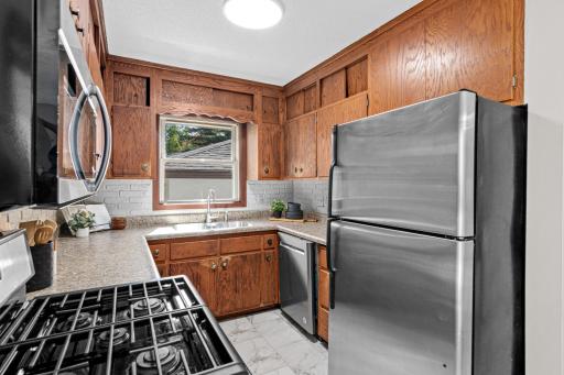 A practical kitchen with a brand-new microwave.
