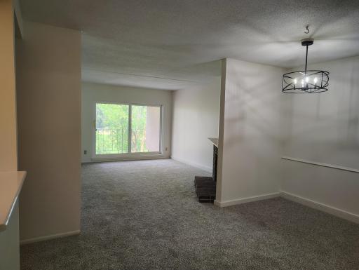Dining room and the living room, can see the fireplace.jpg