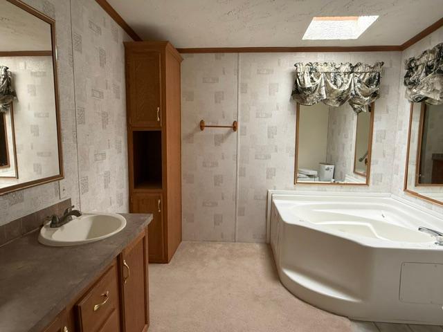 Full bathroom with separate tub and shower