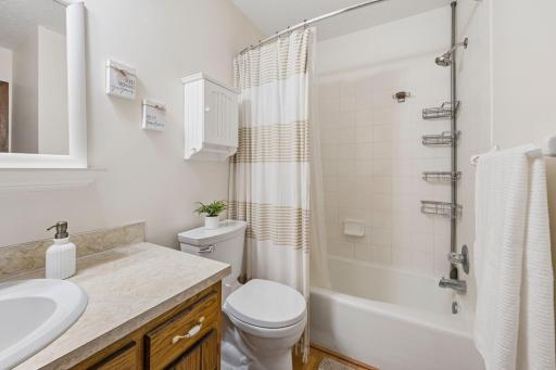 Upper level full bath with oversized vanity.