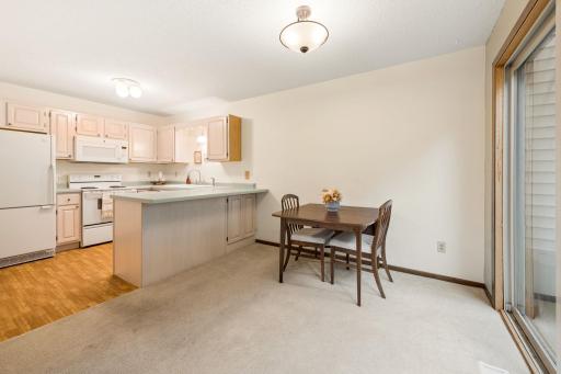 Casual, versatile dining space with room for a large dining table & barstool seating.