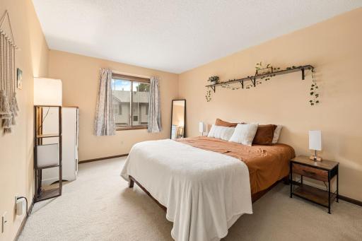 Large upper level primary bedroom with walk in closet & adjacent full bath.