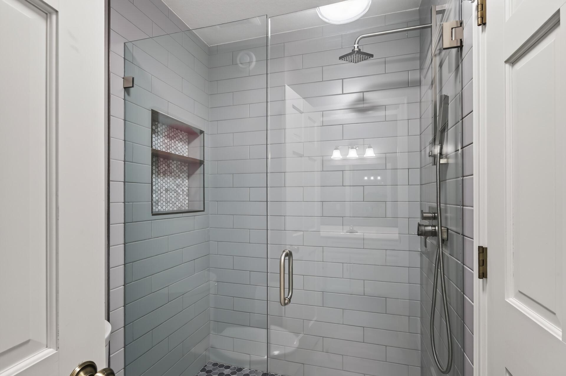 Newly updated upstairs bathroom featuring fresh, modern finishes and timeless style