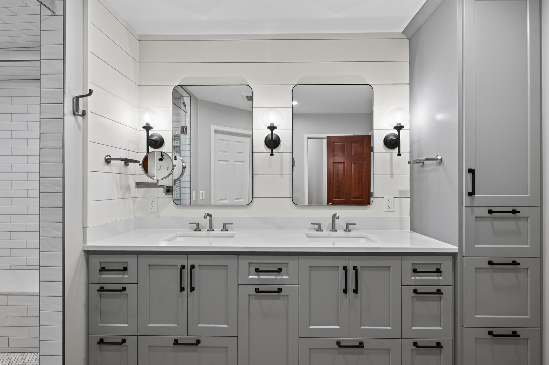 The spacious primary bathroom features dual sinks and abundant storage, making busy mornings effortless