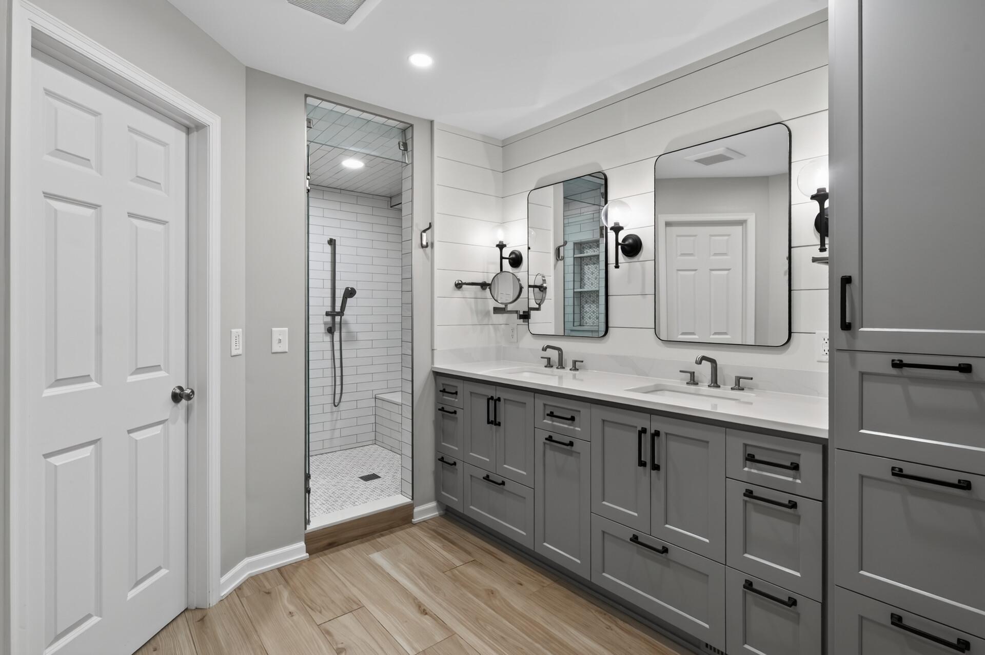 Love the primary bathroom with heated tile floors, a spa-like steam shower, double vanities