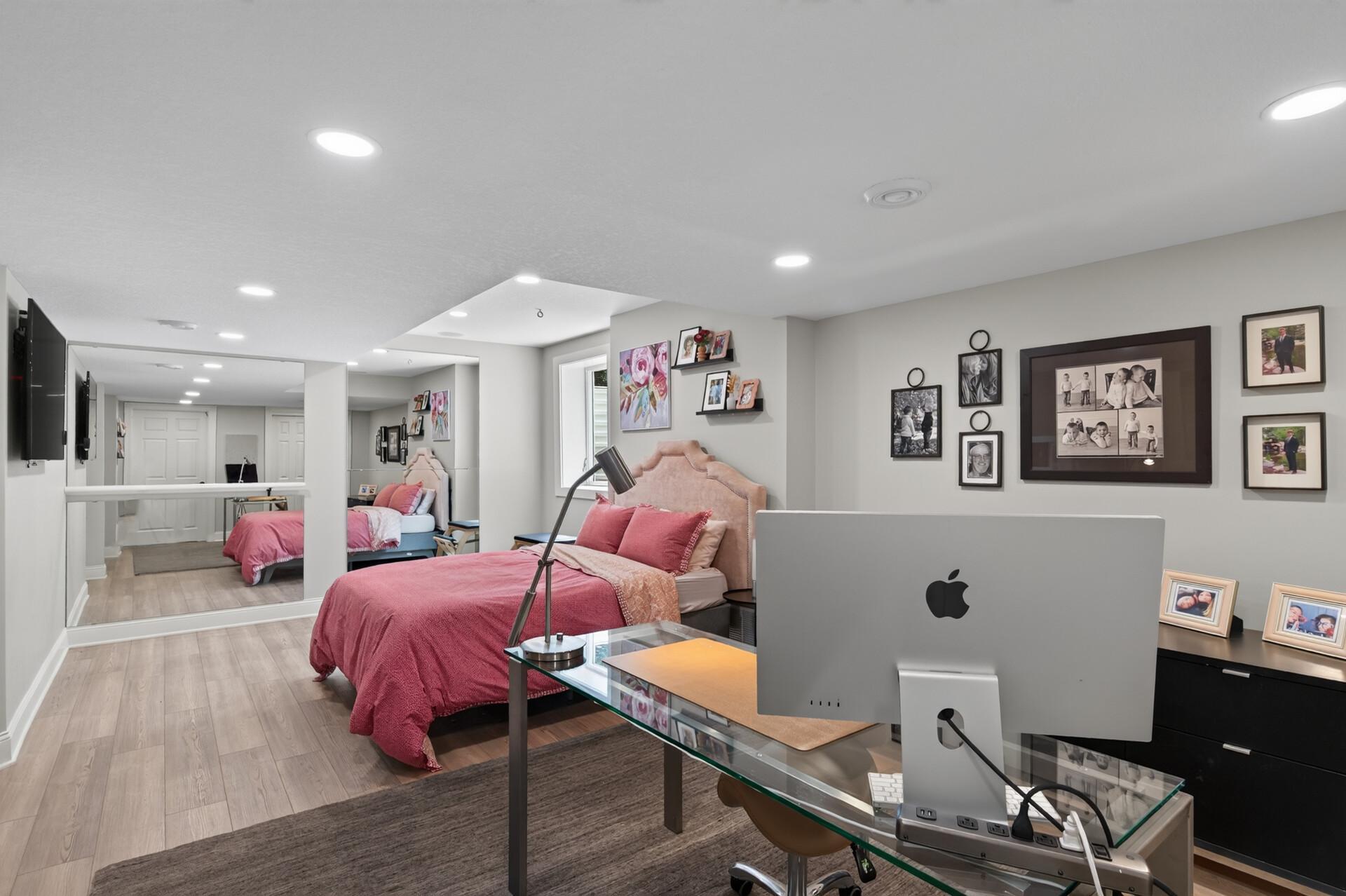 The basement room is a versatile space, perfect for a quiet home office, private workout room, or comfortable guest retreat. French doors add charm while providing privacy and separation from the rest of the lower level.