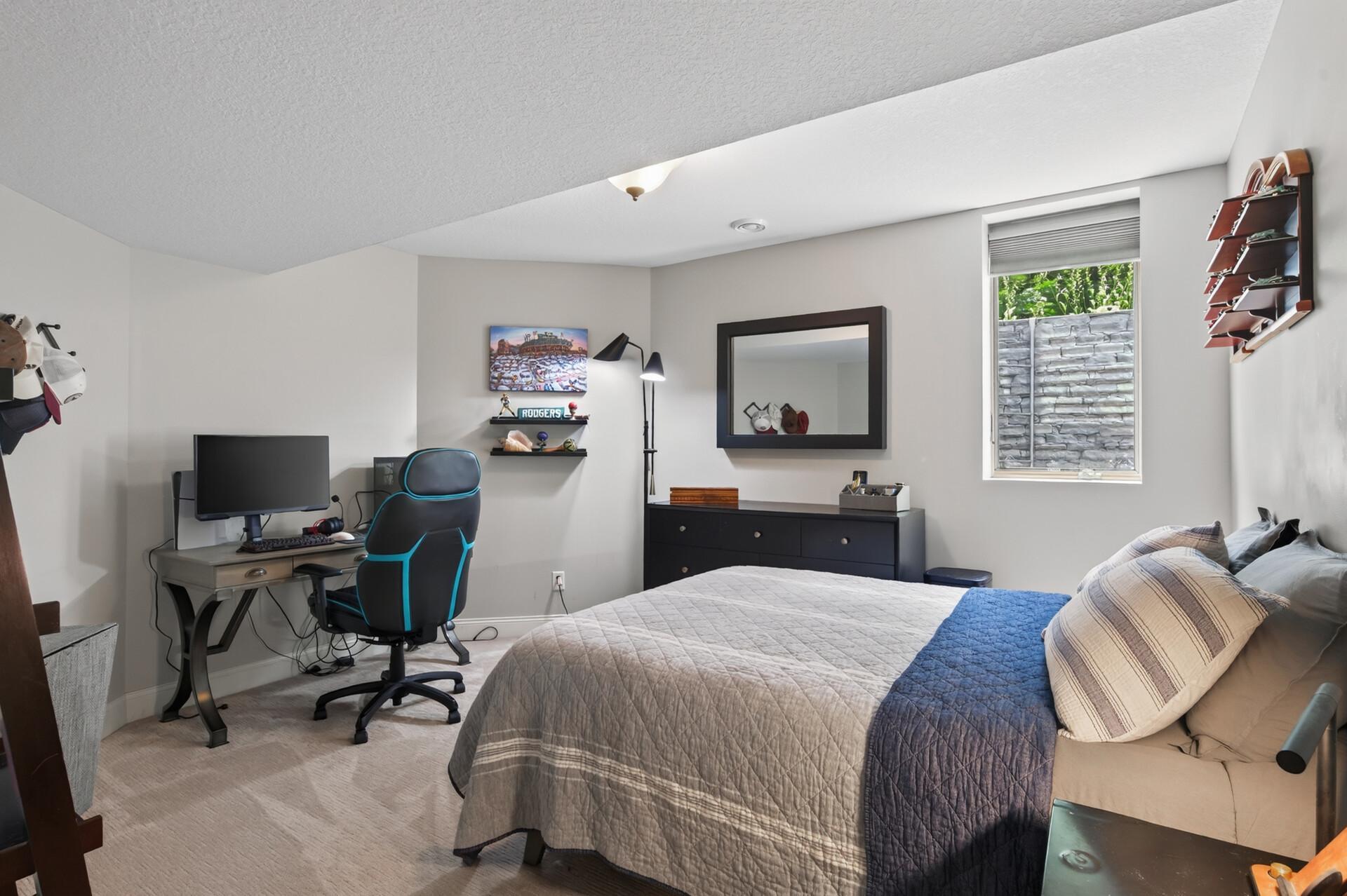 Private lower-level bedroom - perfect for a teenager, overnight guests, or a comfortable multi-generational living space