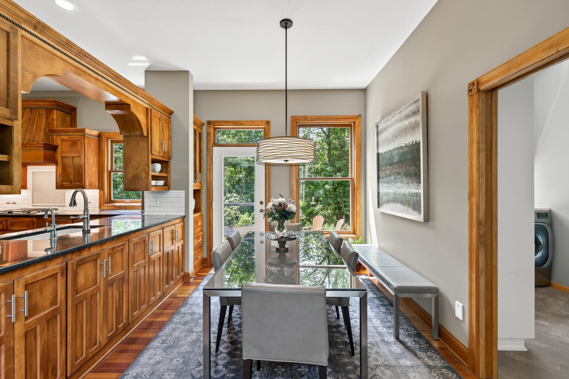 Informal dining area just off the kitchen and patio - perfect for everyday meals, effortless entertaining, and easy access for grilling