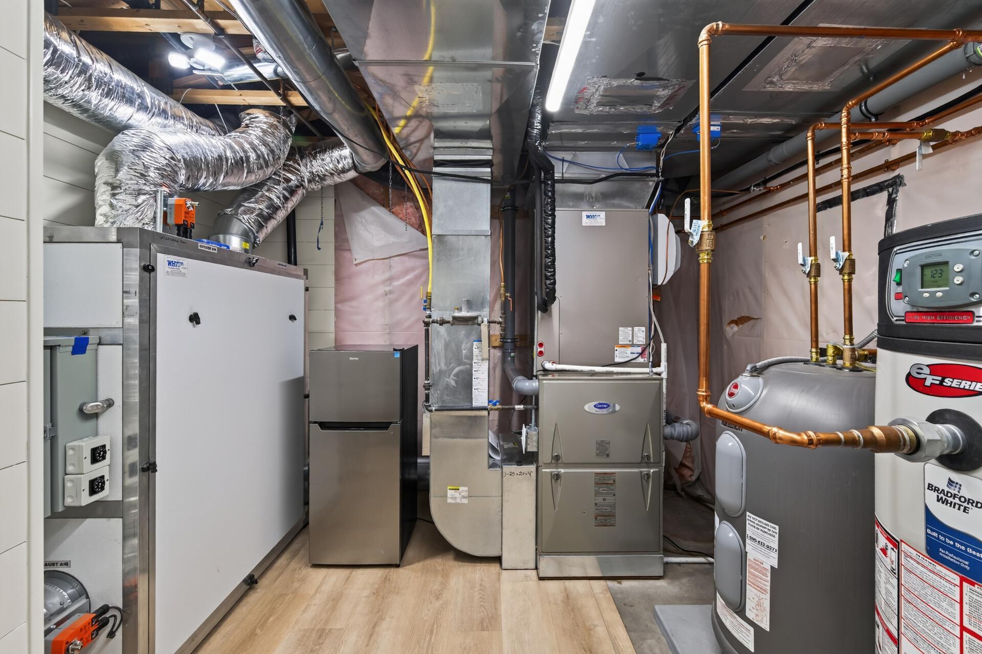 Major improvements include a commercial-grade high-efficiency furnace and air conditioner (2024), new air handler, and a new extra-large, resort-style, commercial water heater designed for continuous use - delivering the comfort of reliable hot water