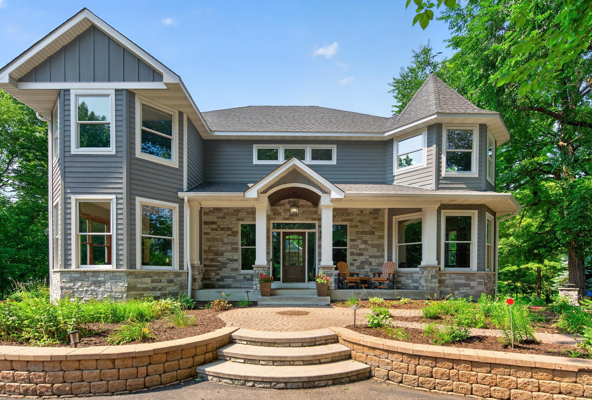 The entire front exterior was transformed in 2023 with new Hardie Board siding, a welcoming front porch, and a new front door.