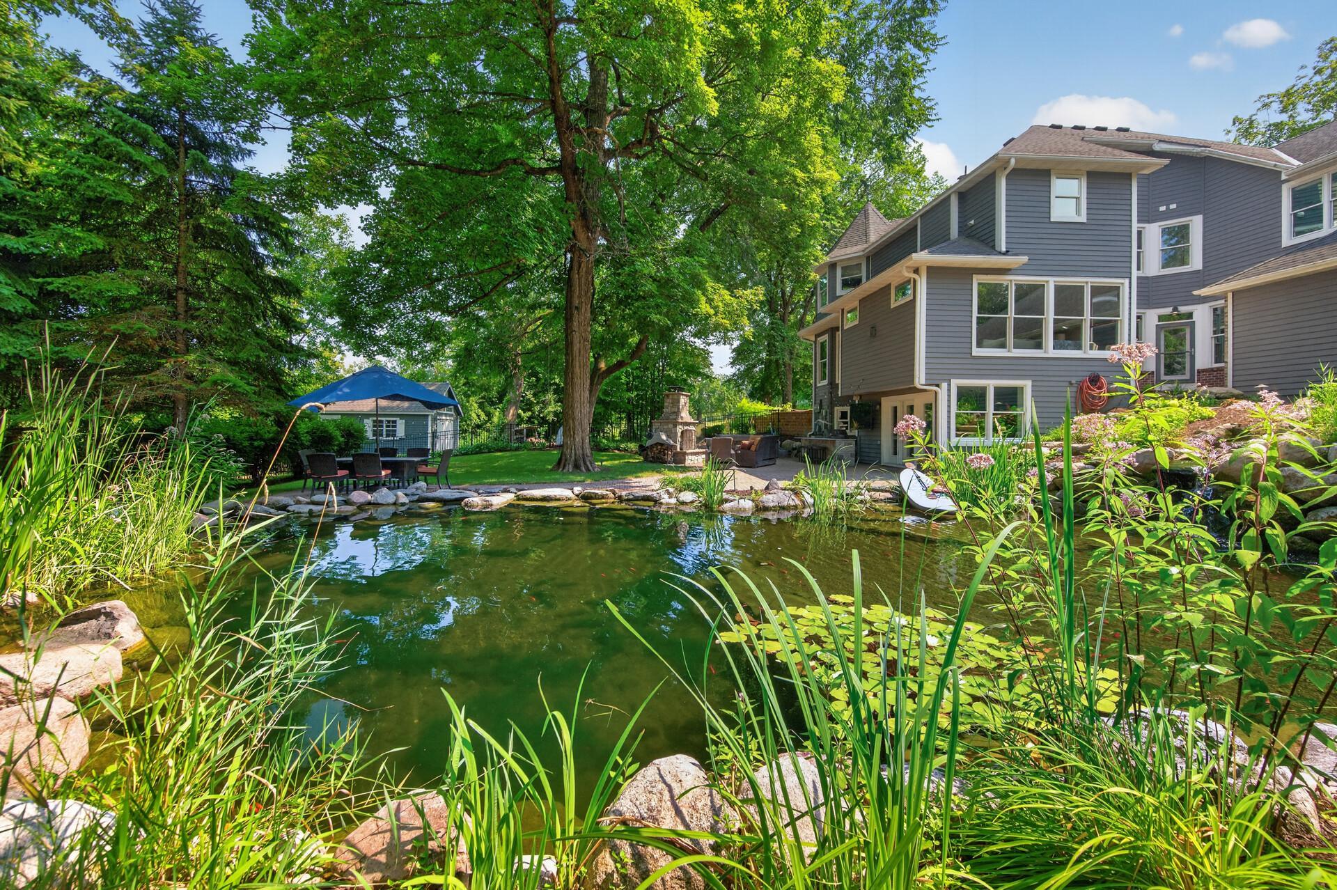 This exceptional property offers a one-of-a-kind natural swimming pond with stunning waterfall features and a commercial heater, creating the ultimate backyard oasis.