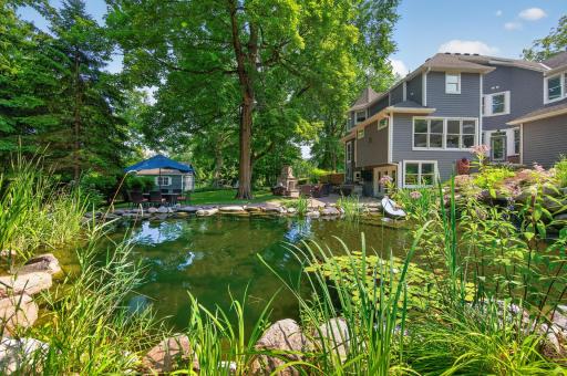 This exceptional property offers a one-of-a-kind natural swimming pond with stunning waterfall features and a commercial heater, creating the ultimate backyard oasis.