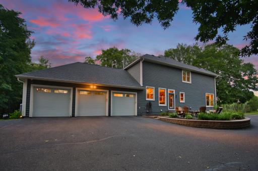 3 car heated garage with extra outdoor parking spots for the kiddos on the side