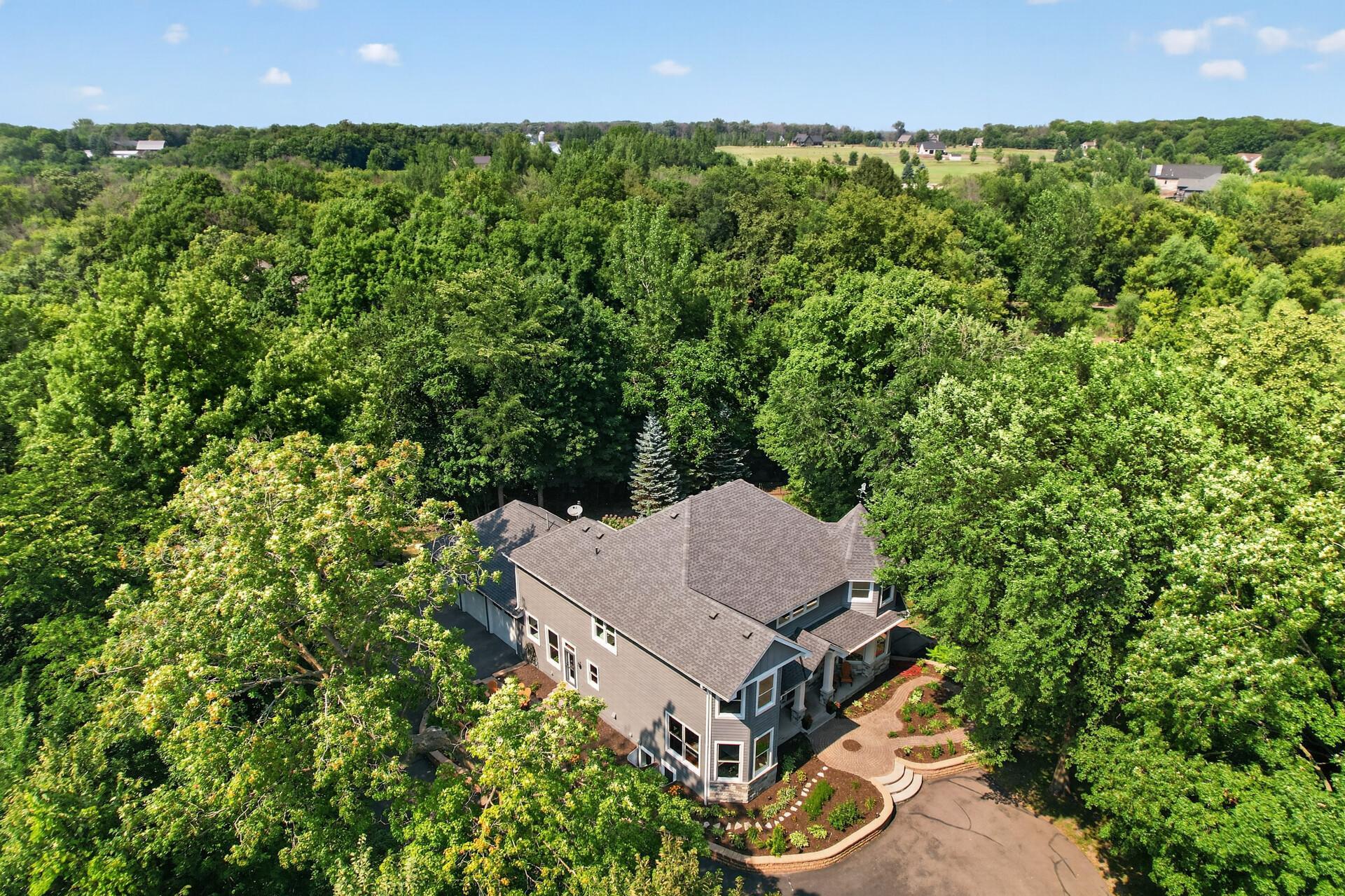 Acres of private, heavily wooded land offer unmatched privacy, peaceful views, and endless room to roam, play, and explore