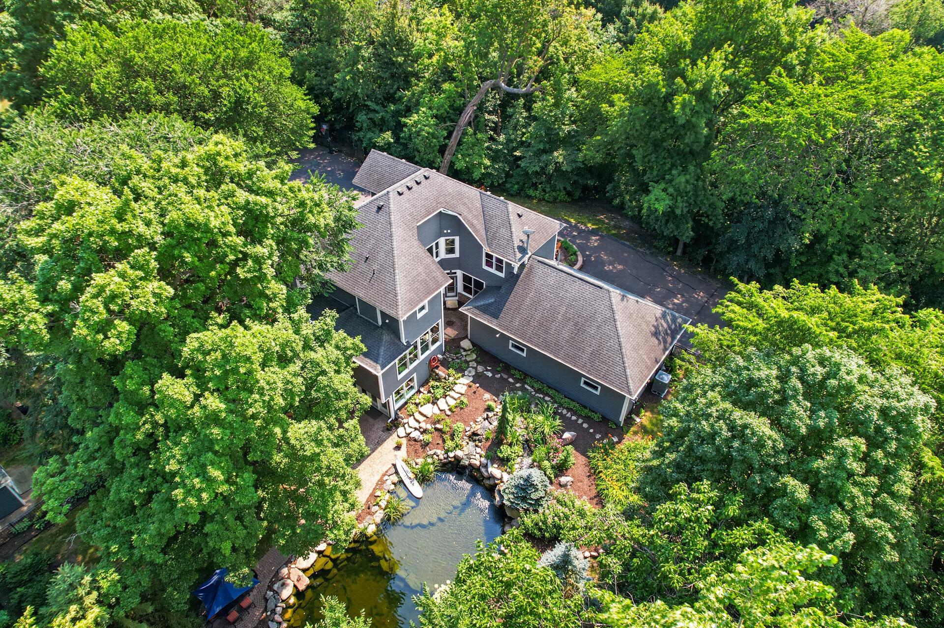 This truly is a backyard unlike any other - a peaceful retreat where nature, recreation, and relaxation come together in every season