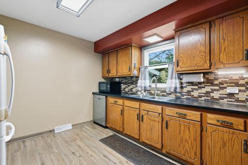 Kitchen with updated counters and backsplash