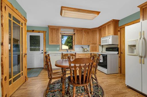 Eat in Kitchen with rustic trim around windows and doors