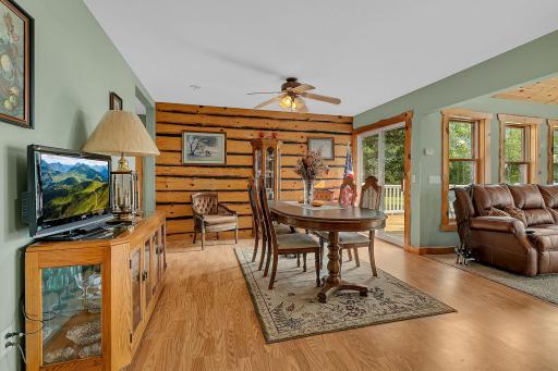 Wood chinked wall anchors the dining room area