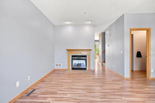 View of living room as you look into the dining room and kitchen area.