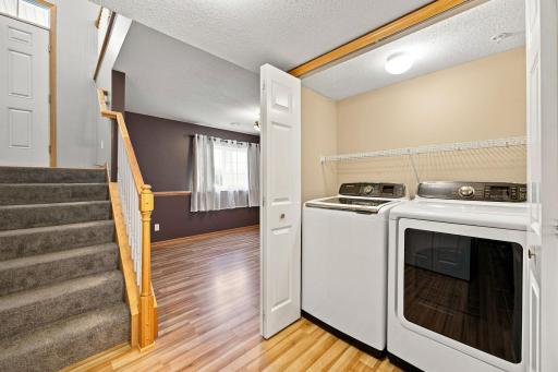 Full size washer and dryer in laundry closet on the lower level.