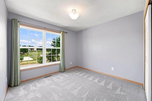The second of the three upper level bedrooms.
