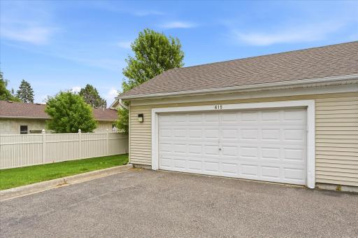 Extra-large, insulated, finished garage with durable epoxy flooring.